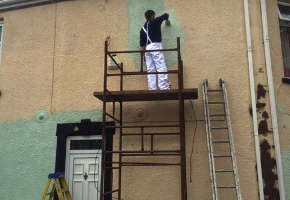 house painting from scaffolding